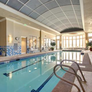A serene indoor swimming pool designed for relaxation and fitness.