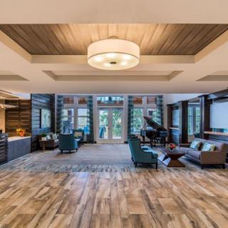 A spacious, elegantly designed living room with modern decor and luxurious touches.