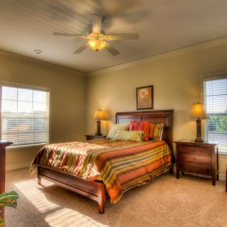 A cozy bedroom with warm lighting and stylish decor.