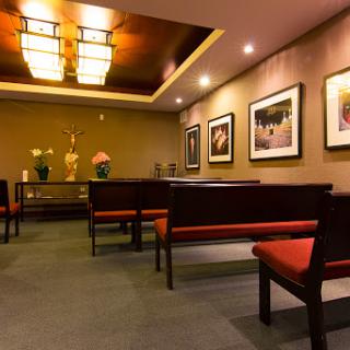 A soothing waiting room featuring modern furnishings and artistic decor.
