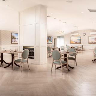 A modern and spacious dining area with elegant seating and tables.