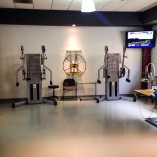 A gym area featuring exercise machines designed for strength training.