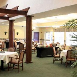 A spacious restaurant dining area with neatly arranged tables and chairs.
