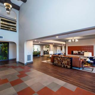Modern lobby with a spacious seating area and stylish decor.