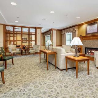 A cozy living room with comfortable seating and warm lighting.
