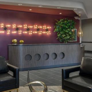 A modern reception area with stylish lighting and comfortable seating.