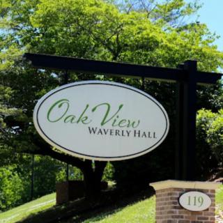 Sign for Oak View Waverly Hall at the entrance of a property.