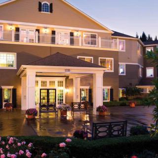 Elegant hotel entrance illuminated in the evening.