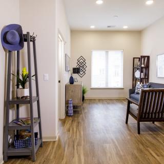 A bright and modern living room with wood flooring and stylish decor.