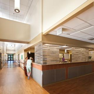 A welcoming hospital reception area featuring modern design elements and a spacious layout.
