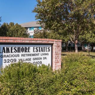 Sign for Lakeshore Estates Gracious Retirement Living, located at 3209 Village Green Drive.