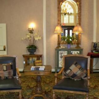 Elegant living room with classic furniture and decorative elements.