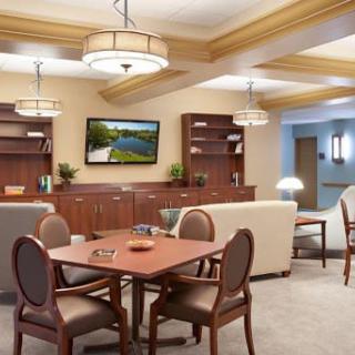 A cozy living room with comfortable seating, a TV, and modern decor.