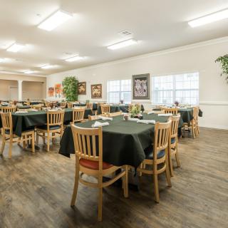 Spacious dining area with neatly arranged tables and chairs.