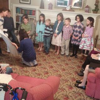 A cheerful gathering of children participating in an indoor event.