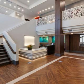 Modern hotel lobby with a reception desk and stylish interior design.