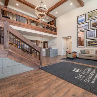 A welcoming hotel lobby featuring elegant wooden architecture and contemporary art.
