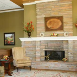 A cozy living room with a brick fireplace and elegant decor.