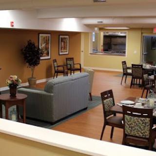 A cozy dining and lounge area featuring comfortable seating and decorative elements.
