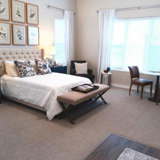 A modern bedroom with elegant decor and a cozy atmosphere.