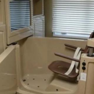An accessible shower with a built-in chair designed for easy mobility.