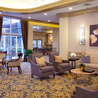 A luxurious hotel lobby with comfortable seating and elegant decor.