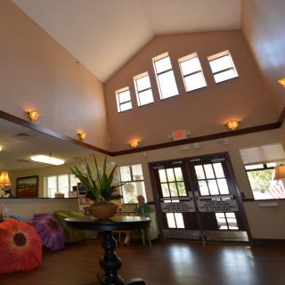 A welcoming lobby with high ceilings and ample natural light.