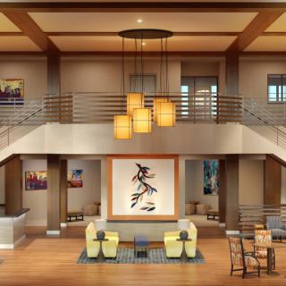 A spacious, modern living room with elegant lighting and contemporary art.