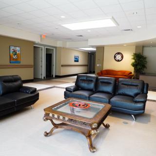 A spacious lobby with comfortable seating and modern decor.