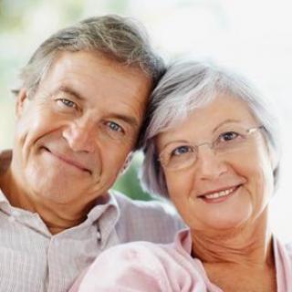 A happy elderly couple smiling and enjoying their time together.