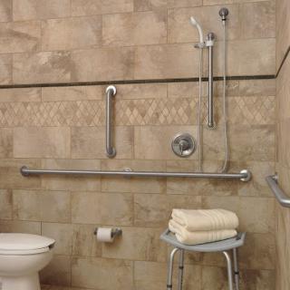 An accessible bathroom equipped with grab bars, a shower chair, and safety features designed for individuals with mobility challenges.