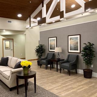 A modern lobby with comfortable seating and decorative elements.