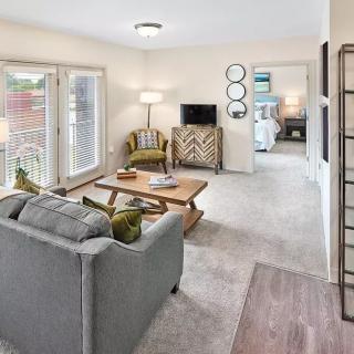 A cozy living room with stylish furniture and modern decor.