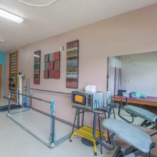 A well-equipped physical therapy room designed for rehabilitation exercises.