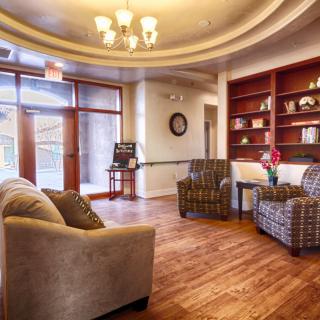 A cozy lobby with comfortable seating and warm lighting.