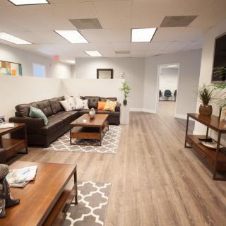 A modern living room with a comfortable couch and stylish decor.