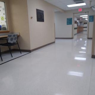 A clean and well-lit hallway in a hospital.