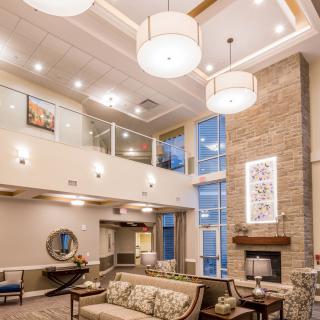 A modern and spacious lobby area with elegant furniture and lighting.