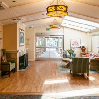 A bright and welcoming lobby area featuring comfortable seating and ample natural light.