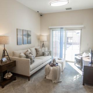 Modern and cozy living room with natural light and stylish decor.