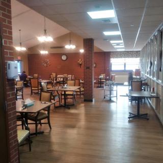 A spacious and inviting dining area with wooden tables and chairs.