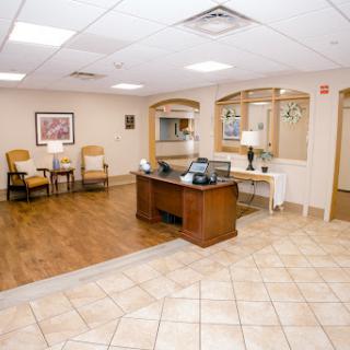 A welcoming reception area featuring comfortable seating and a front desk.