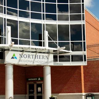 Exterior view of the Northern educational institution with modern glass architecture.