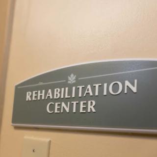 Sign indicating the entrance to a Rehabilitation Center.