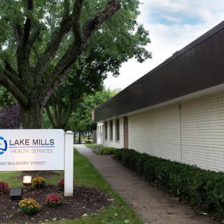 A view of the Lake Mills facility with well-maintained landscaping.