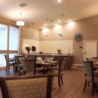 A cozy dining area with elegant lighting and modern decor.