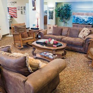 A cozy living room with comfortable sofas and a central coffee table.