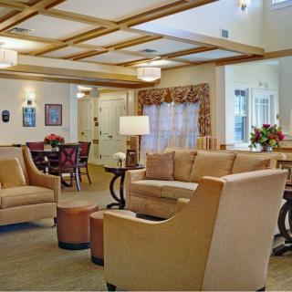 A cozy living room with comfortable seating and warm lighting.