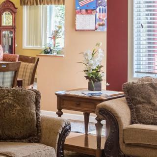 A cozy living room with comfortable seating and elegant decor.