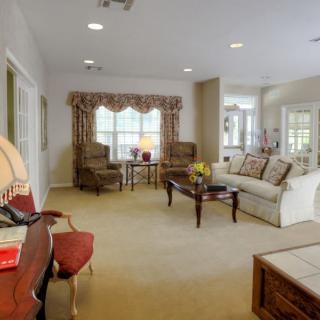 A traditional living room with comfortable furniture and elegant decor.